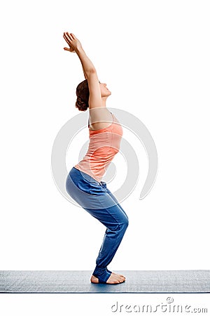 Woman doing ashtanga vinyasa yoga asana Utkatasana Stock Photo