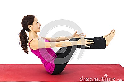 Woman doing boat pose in yoga Stock Photo