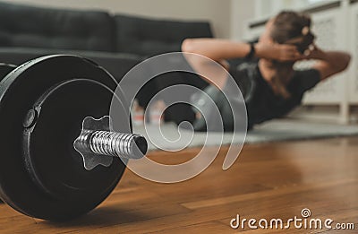 Woman doing crunch exercise. Stock Photo