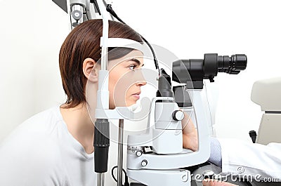 Woman doing eyesight measurement with optician slit lamp Stock Photo