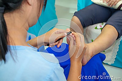 Woman Doing Foot Massage Health Care Treatment in the Spa Editorial Stock Photo