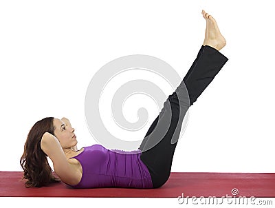 Woman doing Frog Crunch Stock Photo