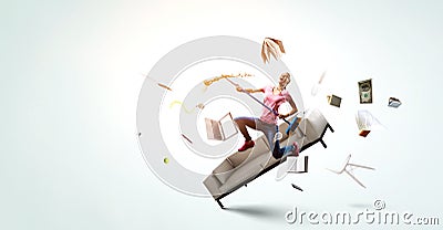 Woman doing funny cleaning. Mixed media Stock Photo