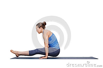 Woman doing Hatha asana Utpluti dandasana - lifted stuff pose Stock Photo