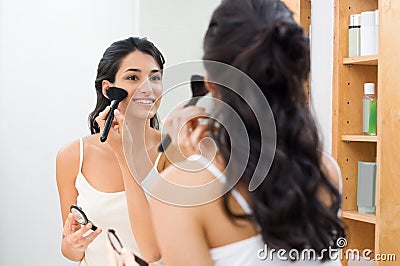 Woman doing make up Stock Photo