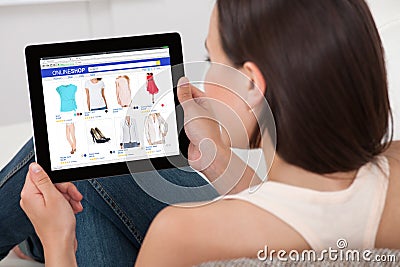 Woman Doing Online Shopping On Digital Tablet Stock Photo