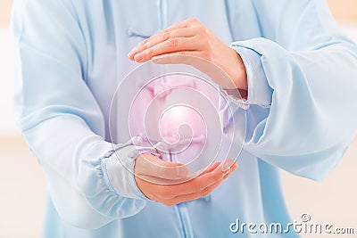 Woman doing qi gong tai chi exercise Stock Photo