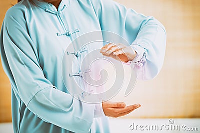 Woman doing qi gong tai chi exercise Stock Photo