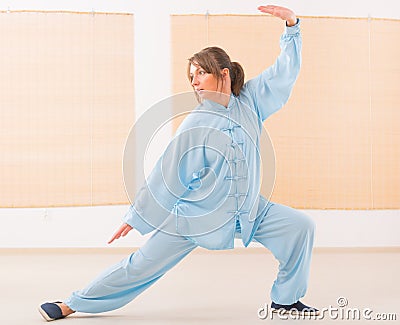 Woman doing qi gong tai chi exercise Stock Photo