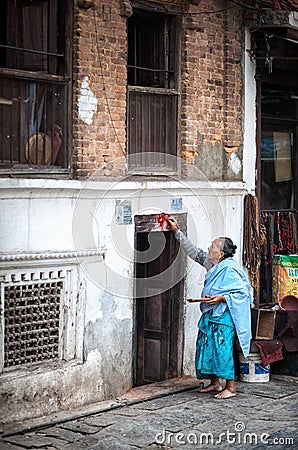 Woman doing ritual in Nepal Editorial Stock Photo