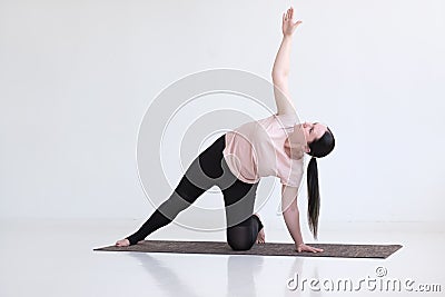 Woman doing Side Plank Posture, Pose of Vashista, Vasisthasana Stock Photo