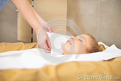 Woman are doing wellness in a therm with a fango pack Stock Photo