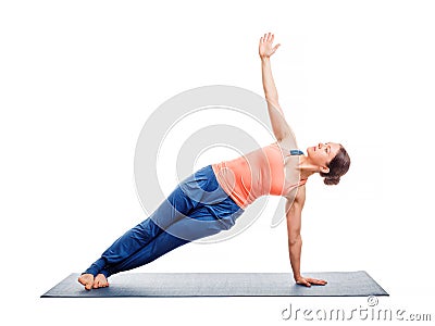 Woman doing yoga asana Vasisthasana Stock Photo