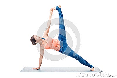 Woman doing yoga asana Vasisthasana variation Stock Photo