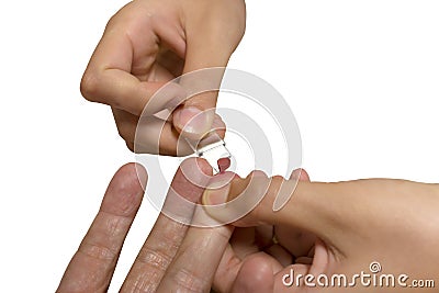 Woman drawing blood from fingertips of man,white isolated Stock Photo