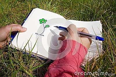 Woman drawing flowers Stock Photo