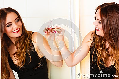 Woman drawing heart on mirror. Stock Photo