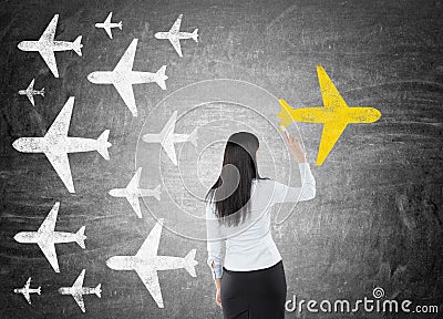 Woman drawing yellow plane Stock Photo