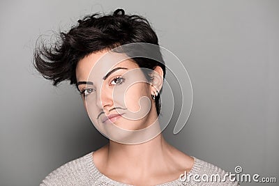 Woman with Drawn Mustaches Stock Photo