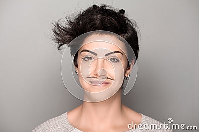 Woman with Drawn Mustaches Stock Photo