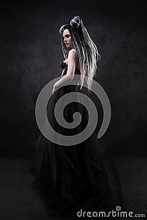 Woman with dreads and black gothic dress Stock Photo