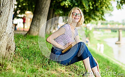 Woman dreaming about vacation. Literature for summer vacation. Summer vacation. Student smart nerd sit on green grass Stock Photo