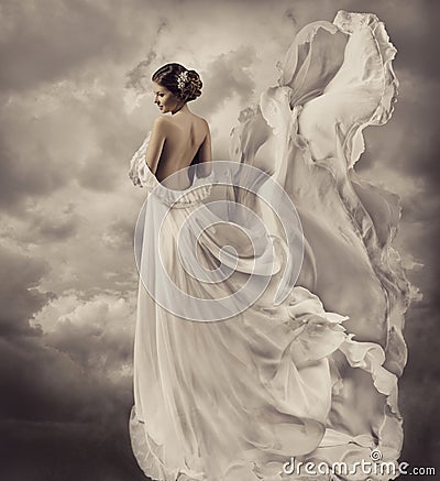 Woman dress, artistic white blowing gown, waving a Stock Photo