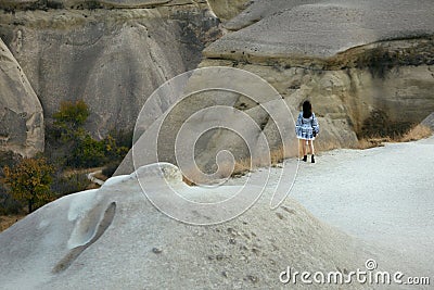 Woman In Dress Traveling In Nature, Standing At Rocks Valley Editorial Stock Photo