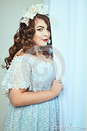 Woman a dress in the window. Stock Photo