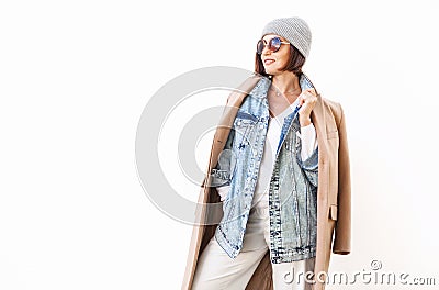 Woman dressed in multilayered outfit for autumn days. Street fashion look Stock Photo