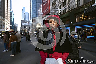 Woman dressed in 19th century attire for Christmas in New York City Editorial Stock Photo