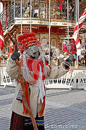 Woman dressed in vintage costume and scary mask at Russian national festival `Shrove` in Moscow Editorial Stock Photo