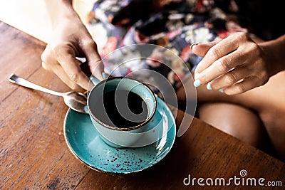 Woman drinking balinese coffee bali kopi. Bali island. Stock Photo