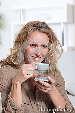 Woman drinking an expresso Stock Photo
