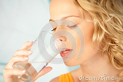 Woman drinking mineral water Stock Photo