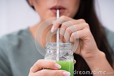 Woman Drinking Organic Smoothie Stock Photo