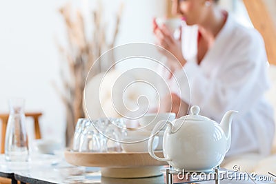 Woman drinking tea in wellness spa Stock Photo