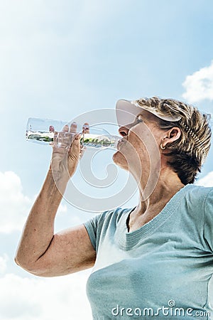Woman Drinking Water After Exercise Concept Stock Photo