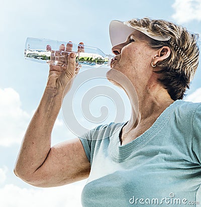 Woman Drinking Water After Exercise Concept Stock Photo