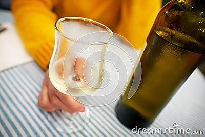 Woman drinks white homemade wine Stock Photo