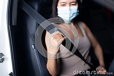 Woman driver fastens seat belt before driving a car,Safety concept for vehicles Stock Photo