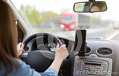 A woman driving a car on a fast road Stock Photo