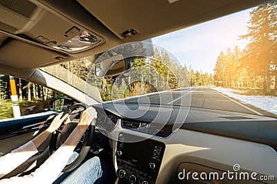 Woman driving car in tundra admiring the beautiful landscape Editorial Stock Photo