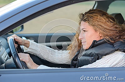 Woman is driving her car Stock Photo