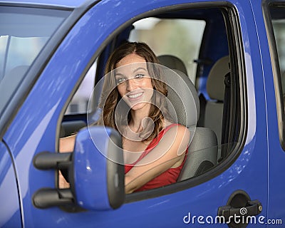 Woman driving her new car Stock Photo