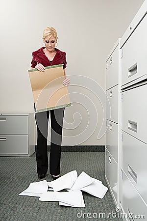 Woman dropping files Stock Photo