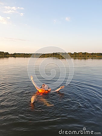 a woman drowns in a life jacket , safety on the water Stock Photo