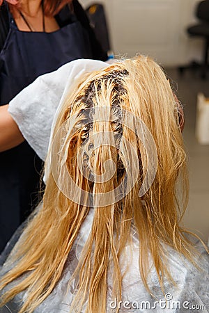 Woman dyeing hair Editorial Stock Photo