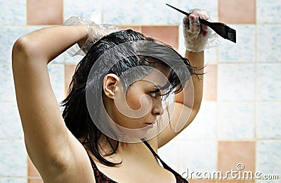 Woman dyeing hairs Stock Photo