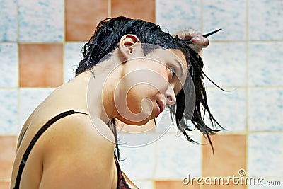 Woman dyeing hairs Stock Photo